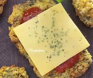 Ternera con salsa de tomate, queso y orégano